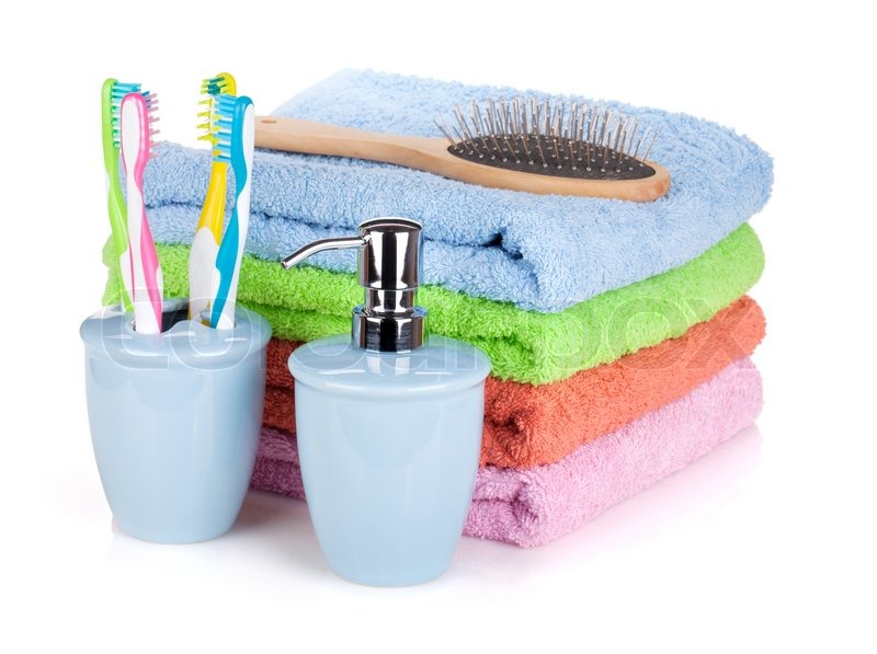 5746757-four-toothbrushes-liquid-soap-hairbrush-and-colorful-towels