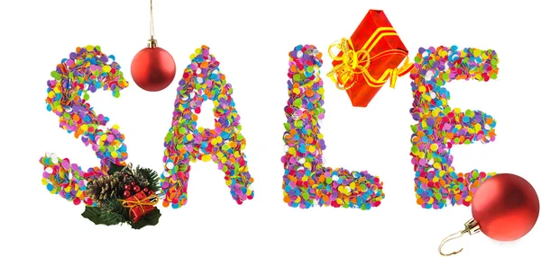 Слово продажа формируется из красочных конфетти с рождественские украшения — стоковое фото