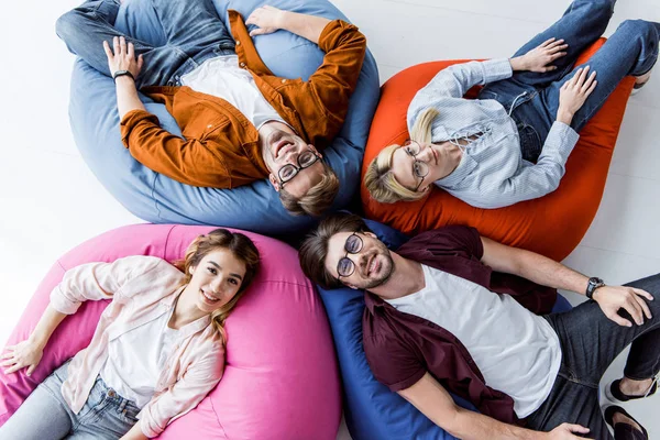 Top View Multicultural Colleagues Startup Project Lying Bean Bag Chairs — стоковое фото